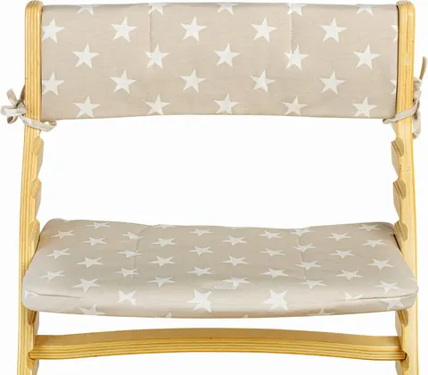 Tan cushion with white stars tied onto the Fornel seat and backrest